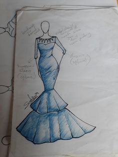 a drawing of a blue dress on top of a piece of paper