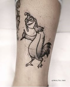 a black and white photo of a cartoon character on the leg