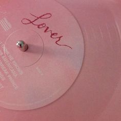 a pink record with the word love written on it