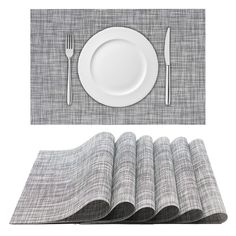 the place setting is ready to be served with silverware, napkins and utensils