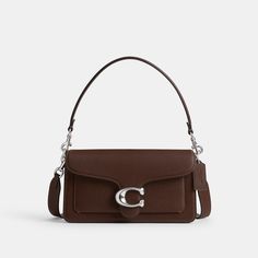 A modern take on an archival 1970s Coach design our structured Tabby shoulder bag is crafted of polished pebble leather. Finished with our Signature hardware for an iconic touch the compact 26 features two detachable straps to carry by hand style as a short shoulder bag or wear crossbody. | Coach Tabby Shoulder Bag 26 - Women's - Silver/maple Coach Tabby 26, Coach Tabby Shoulder Bag, Tabby Shoulder Bag, Coach Tabby, Hand Style, Structured Bag, Polished Pebble, Signature Hardware, Mini Shoulder Bag