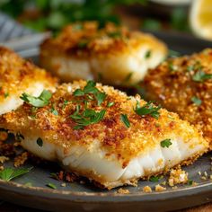 some kind of fish on a plate with parsley sprinkled around it's edges