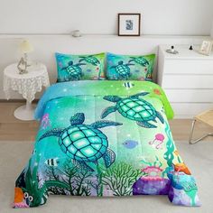 a bed room with a neatly made bed and sea animals on the comforter cover