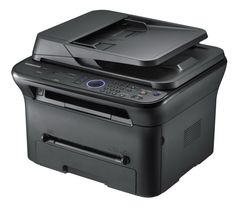 a printer that is sitting on top of a white surface, with the lid open