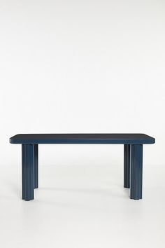 a blue bench sitting on top of a white floor