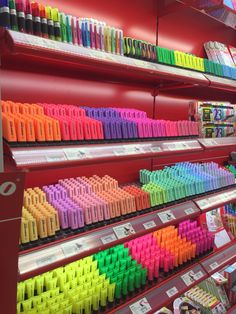 there are many different colored crayons on display