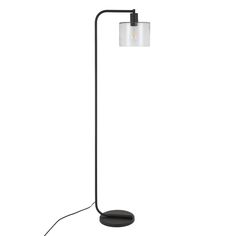 a black floor lamp with a white shade on it's side and a round base