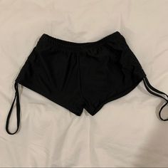 Black Drawstring Stretchy Shorts Never Worn Small Stretchy Ready To Ship Summer Workout Tie-side Bottoms, Black Tie-side Bottoms For Summer, Tie-side Bottoms For Summer Night Out, Casual Adjustable Bottoms With Drawstring, Casual Adjustable Drawstring Bottoms, Sporty Summer Bottoms From Forever 21, Casual Adjustable Tie-side Bottoms, Casual Black Adjustable Swimwear, Black Tight Shorts