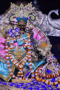 the statue is decorated with colorful decorations