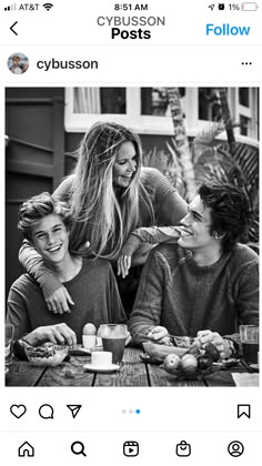 two women and a boy sitting at a table with food in front of them on instagram