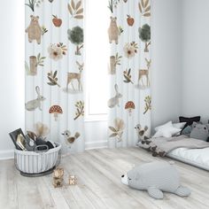 a child's bedroom with white walls and wooden floors, decorated in woodland animals