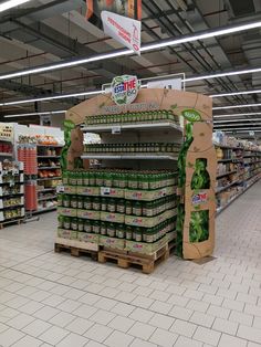 an aisle in a grocery store filled with lots of food and drinks on display for sale