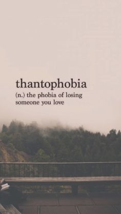 a person sitting on a bench with the words thantophobia above them