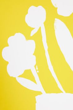 a yellow and white painting with flowers on it