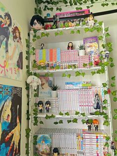 a book shelf filled with books and anime figurines on top of it's shelves