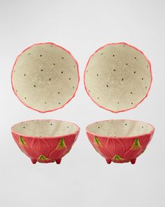 three red and white bowls sitting on top of each other