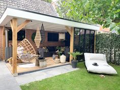 an outdoor living area with furniture and plants