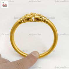 ❤️About the Item❤️ ✔ This beautiful Real Gold Bangle Bracelet has a designer elephants face facing each other, this is a thick chunky bracelet made by experienced Indian craftsmen which symbolizes the grandness of an elephant yet subtly indicating your calm and soothing aura. ❤️DISCOUNT AND OFFERS❤️ ✔ Please contact us for any discounts or offers that are available on this item. We also provide discounts on bank transfers. Please check the payments methods below! ❤️CUSTOMIZATION❤️ ✔ Please check our designs listed in our store and don't hesitate to contact us with any custom made jewelry piece. ✔ We can engrave custom text of your choice, just drop a message regarding whatever you want to get engraved. ✔ Custom Sizing ❤️WEIGHT AND SPECIFICATIONS❤️ ✔ 14 KARAT Gold Weight :- 15.160 Grams App Baby Bangles Indian Gold, Gold Kada Design For Women, Gold Designer Bracelet, Real Gold Bracelet, Elephant Bangle, Elephant Face, Gold Bangles For Women, Handmade Elephant, Fancy Jewelry Necklace