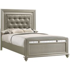 an upholstered bed with tufted headboard and foot board is shown in silver