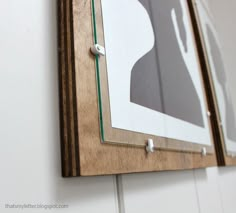 a wooden frame hanging on the wall