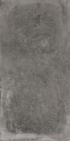 an old grungy concrete wall textured with light gray paint and some stains