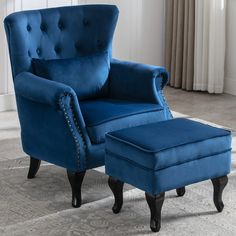 a blue chair and ottoman in a room