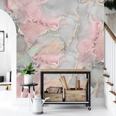 a marbled wall with pink and gold accents in a living room or dining room