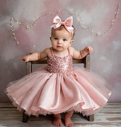 "Dress your little one in a fairy tale come true with our \"Enchanted Rose\" dress. Designed with love for special occasions, this dress features delicate hand-sewn sequins on the bodice that sparkle with every giggle and twirl. The voluminous tulle skirt in blush pink floats like a dream, perfect for birthdays, photoshoots, or any time your toddler wants to feel like royalty. The dress comes with a matching satin bow headband, completing a look that's as enchanting as it is memorable. Made with Birthday Dress Toddler, Baby Princess Dress, Baby First Birthday Themes, Toddler Birthday Dress, Toddler Princess Dress, First Birthday Dress, 1st Birthday Dresses, Pink Flower Girl Dresses, First Birthday Dresses