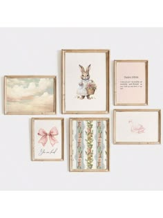 several framed pictures are hanging on the wall with flowers and animals in them, including a bunny