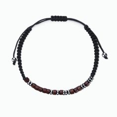 a black and brown beaded bracelet with silver beads