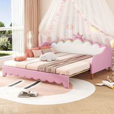 a pink and white bed in a bedroom with curtains on the window sill above it