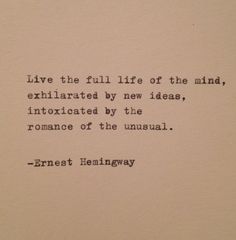 an old typewriter with the words, live the full life of the mind, exhaled by new ideas, introduced by the romance of the unusual