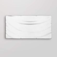 a white wall hanging on the side of a wall