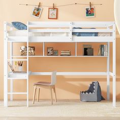 a white bunk bed sitting next to a desk and chair