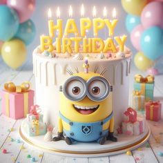 a birthday cake with a minion sitting in front of it and balloons around it