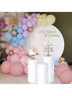 there are balloons and candles on the table