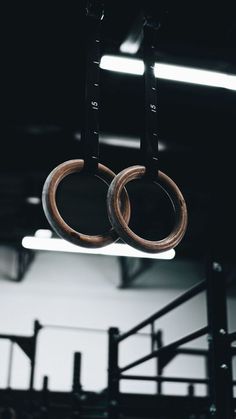 two rings hanging from the ceiling in a gym