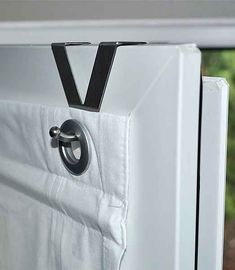 a close up of a white refrigerator with a black handle on it's door