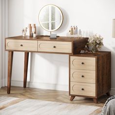 a wooden desk with drawers and a mirror on the wall above it in a white room