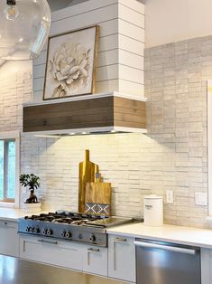 a stove top oven sitting inside of a kitchen