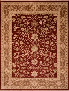 a red and beige rug with an intricate design