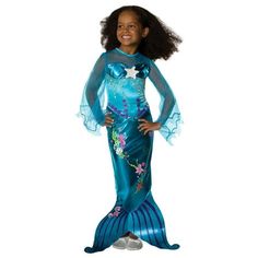 Your little girl will look fabulous under the sea when wearing the Magical Mermaid Toddler/Child Costume. This full length look is perfect for a cold Halloween night. The dress features an illusion neckline that matched the long flowing sleeves. Nautical designs are printed right onto the gown, ending in a tail fin. Halloween will go swimmingly this year when you order the Magical Mermaid Toddler/Child Costume today! Size: 2T-4T.  Color: Multicolor.  Gender: female.  Age Group: kids. Toddler Fish Costume, Princess Ariel Dress, Princess Dress Patterns, Mermaid Halloween Costumes, Fish Costume, Magical Mermaid, Mermaid Halloween, Marine Uniform, Bubble Guppies