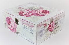 a white box with pink roses painted on it