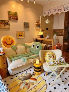 a living room filled with lots of furniture and decor on top of tiled flooring