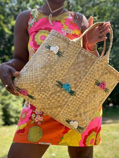 The perfect accessory for warm weather days, this Straw Floret Tote is the essential summer accessory. Crafted with natural straw, this tote bag is adorned with bright and colorful summer flowers for a vibrant addition to your wardrobe. 100% straw grass Handmade  18"W x 14"H x 4"D Multicolor Beach Bags For Spring, Spring Travel Bohemian Straw Bag, Spring Natural Color Rectangular Bag, Chic Straw Bag For Spring Picnic, Chic Spring Straw Bag For Picnic, Beachy Beach Bag For Summer Outings, Summer Beach Tote Bag, Bohemian Beach Bag With Braided Handles For Summer Outings, Natural Bags With Braided Handles For Summer Outings