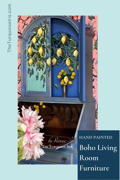 a blue cabinet with yellow flowers painted on it and the words hand painted boho living room furniture