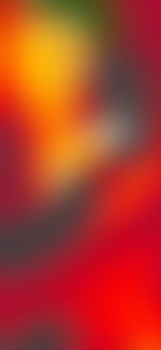 an abstract blurry background in red, yellow and green