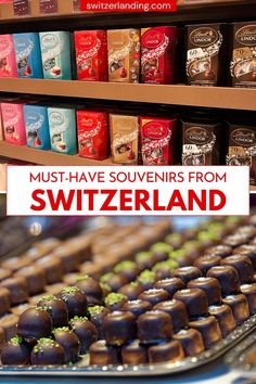 chocolates are on display in a store with the words must have souvenirs from switzerland