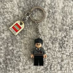 a lego harry potter keychain is on the carpet