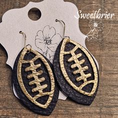 black and gold leather earrings with football design